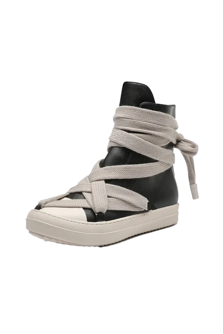 A high-top platform sneaker featuring a black leather upper wrapped with wide, light beige canvas straps that wrap around the ankle and foot, set against a plain white background.