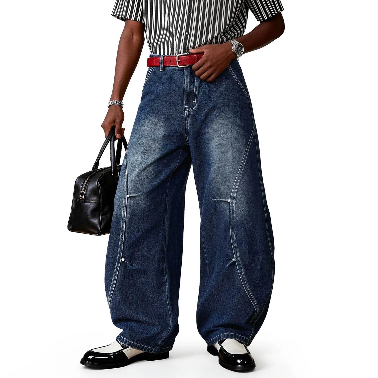A person wearing blue splicing ultra baggy wide leg jeans.