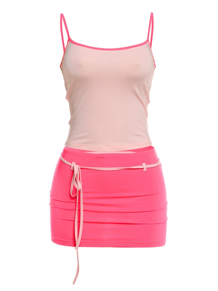 Pink tank top and skirt set on a white background