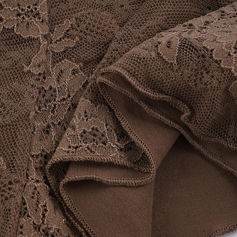 Close-up of brown lace fabric with intricate patterns