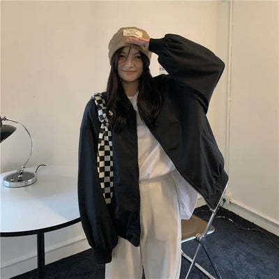 Model wearing the black Urban Oversized Bomber Jacket