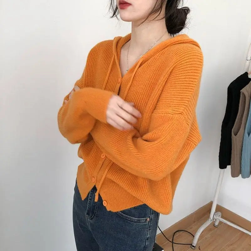Model wearing the orange Knitted Hooded Sweater 