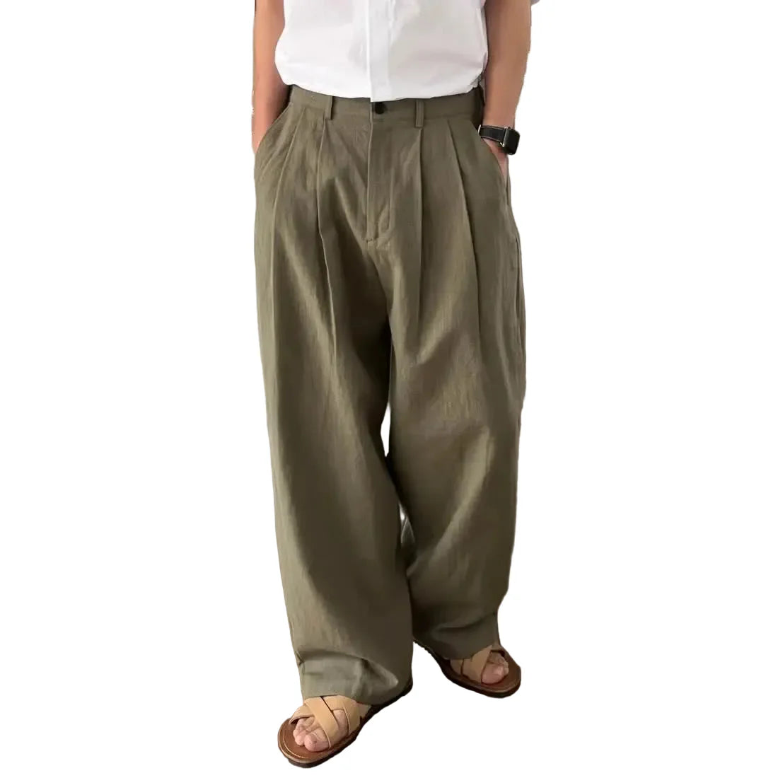 Person wearing olive green wide-leg pants in a kitchen setting