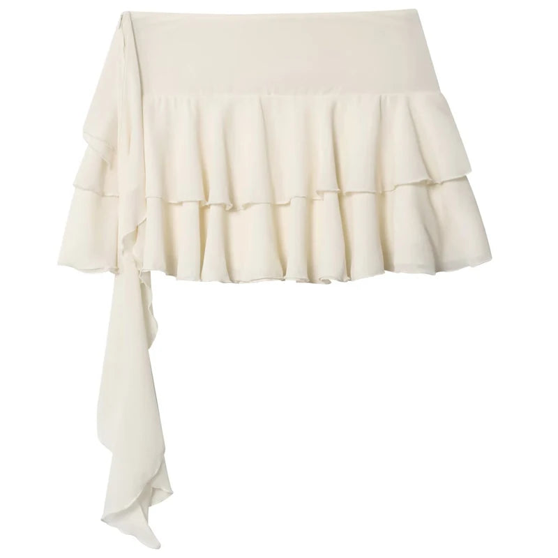 An off-white ruffled mini skirt with a wide waistband and a long side drape, shown against a plain white background.