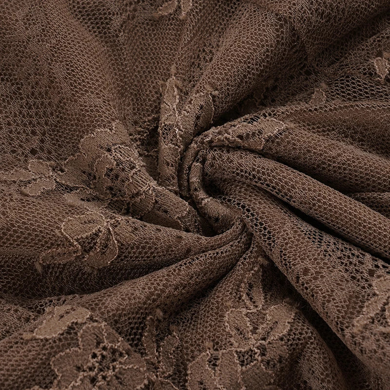 Close-up of brown lace fabric with floral patterns