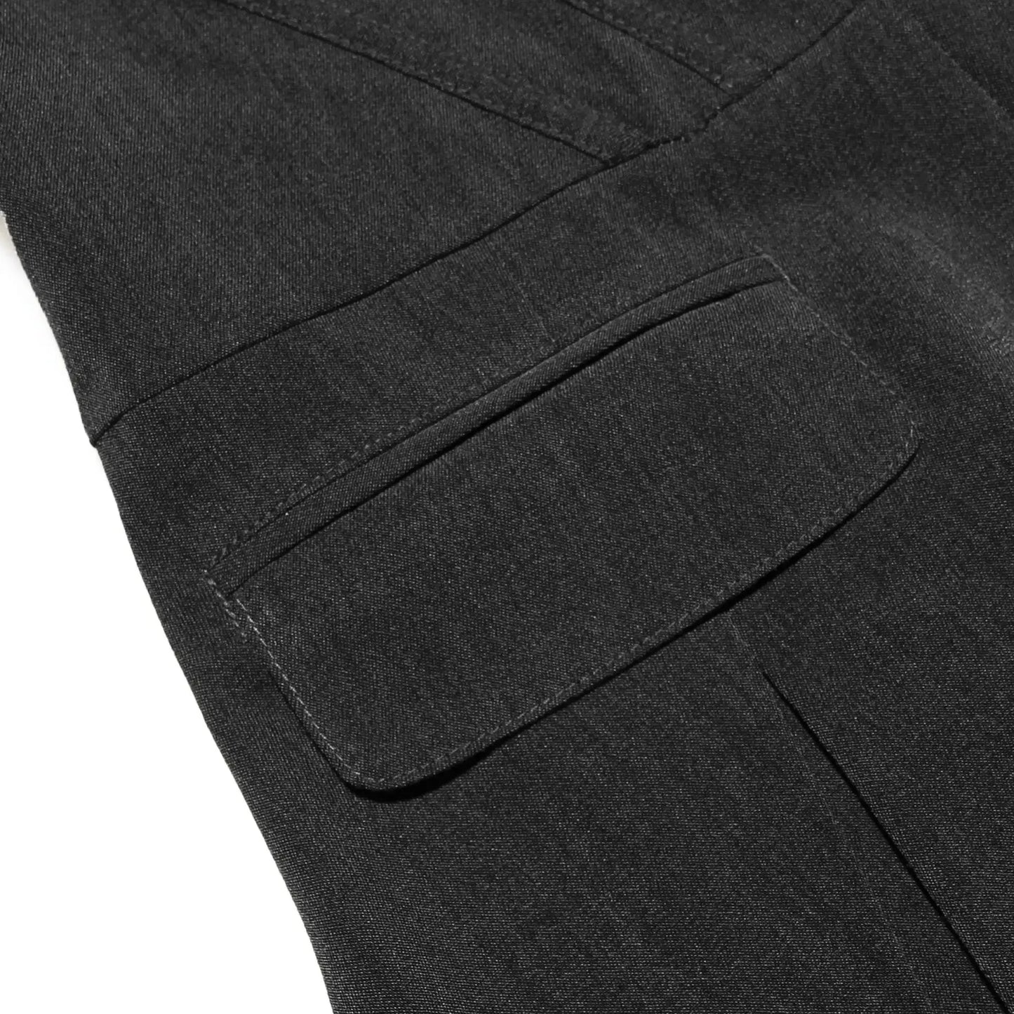 Close-up of a dark gray fabric with a pocket detail on a white background