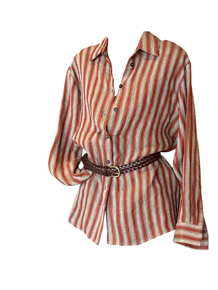 A long-sleeve button-up shirt with vertical rust-orange, beige, and brown stripes, styled with a dark brown braided belt on a white background with a fashion magazine layout on the left.