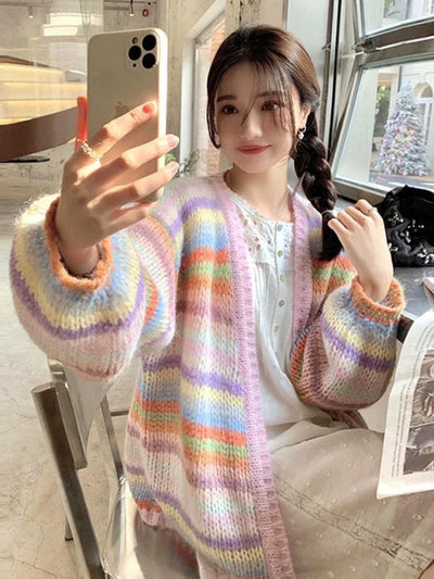 Model wearing the pink Cozy Striped Knit Sweater