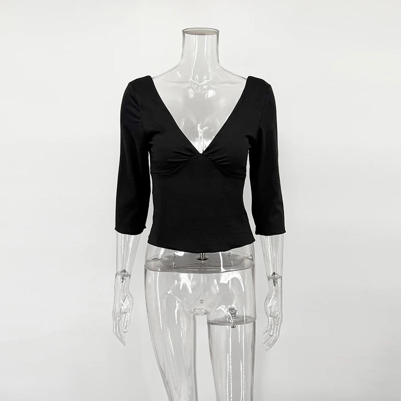 Black top on a transparent mannequin against a white background