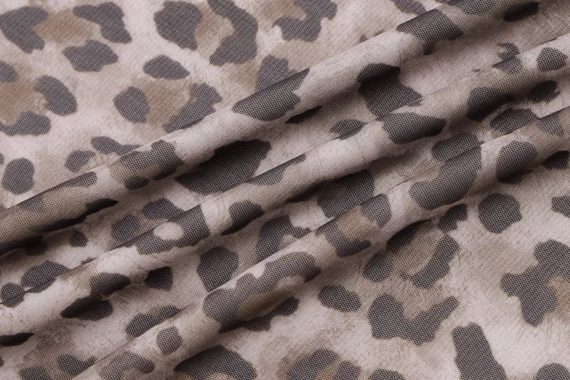 Camouflage-patterned fabric with brown and black colors
