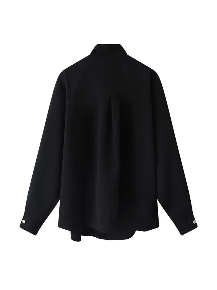 A black long-sleeve button-up shirt with a high collar, shown from the back on a plain white background.
