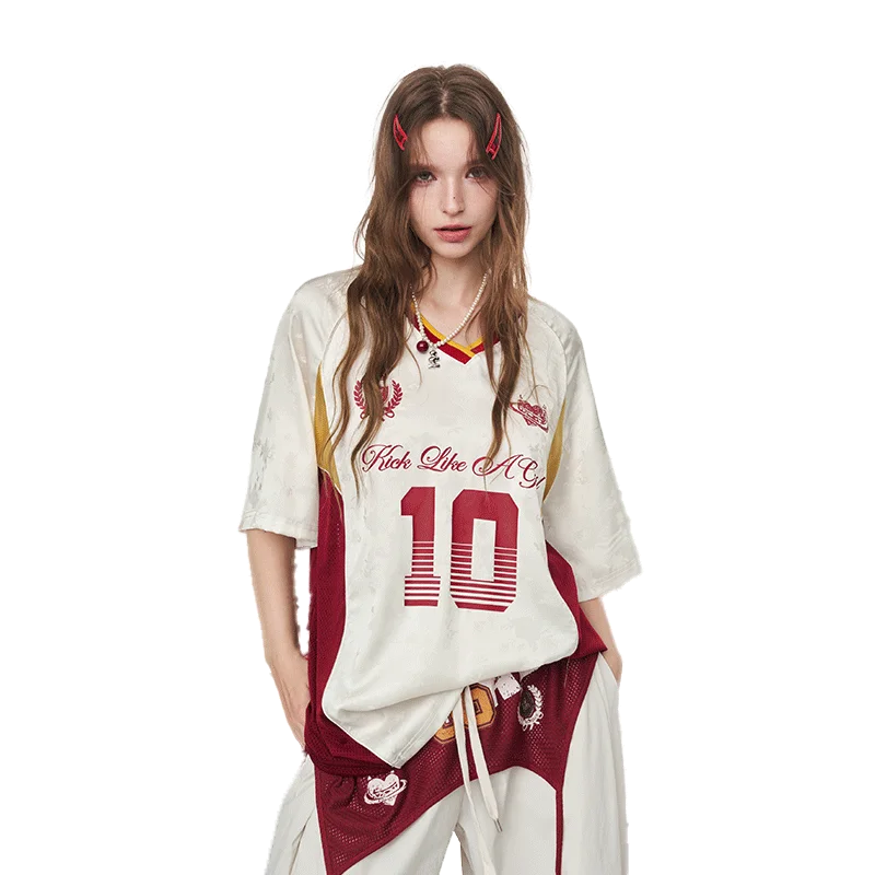 A model wearing a white and maroon basketball jersey t-shirt with 'Fast Lane NYC' and the number '10' printed on the front, paired with matching maroon and white pants, against a plain white background.