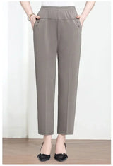 Person wearing gray pants on a white background