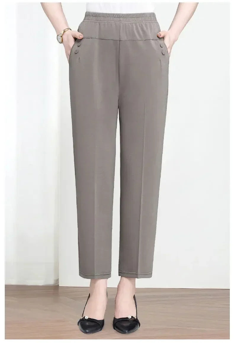 Person wearing gray pants on a white background