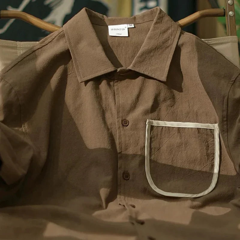 Camisa de algodón de manga corta con bolsillo delantero suelto