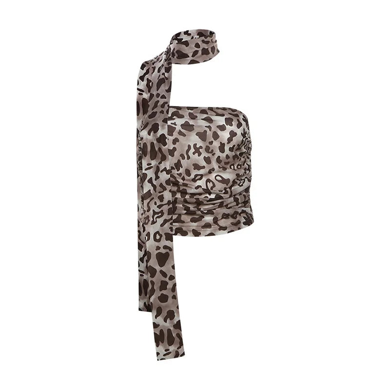 A one-shoulder wrap top with a brown and beige leopard print pattern, featuring a tie-neck strap and a gathered, ruched bodice, shown against a plain white background.