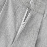 Pantalones anchos de un solo color con botones