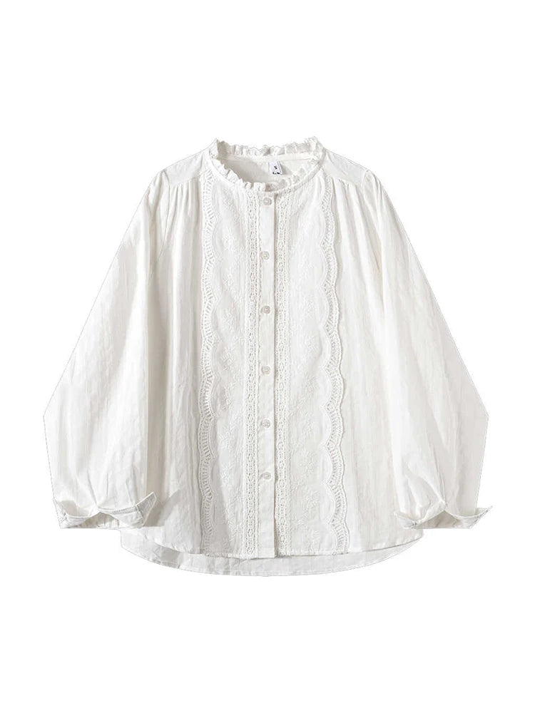 A white long-sleeve blouse with a scalloped eyelet lace front panel, ruffled stand collar, and button front, shown on a plain white background.