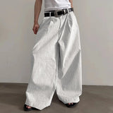 Pantalones anchos de un solo color con botones
