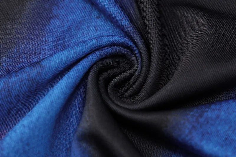 Close-up of blue and black fabric with a swirl pattern
