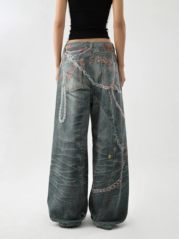 Back view of a  women wearing indie aesthetic chains graffiti straight leg high waisted jeans.