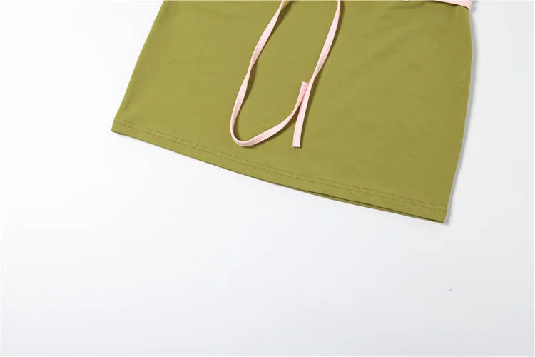 Green fabric with pink drawstring on a white background