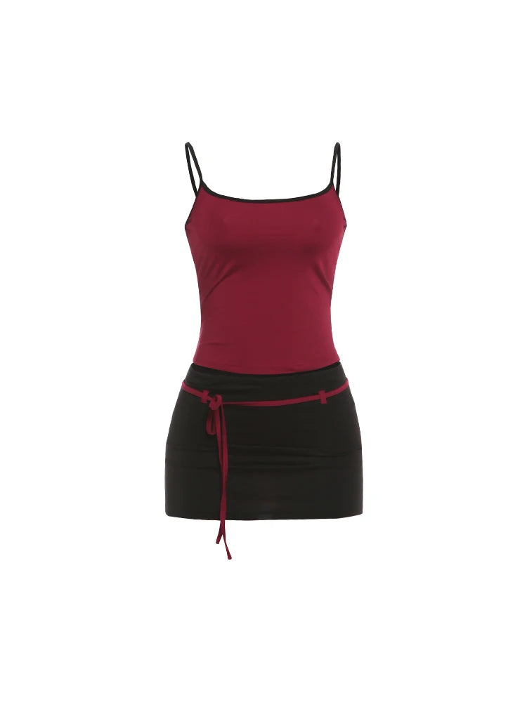 Red tank top and black skirt with red waistband on a white background