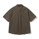 Camisa de algodón de manga corta con bolsillo delantero suelto