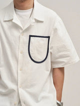 Camisa de algodón de manga corta con bolsillo delantero suelto