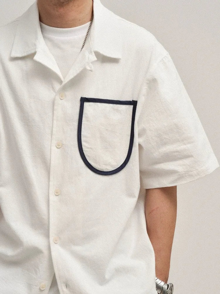 Camisa de algodón de manga corta con bolsillo delantero suelto