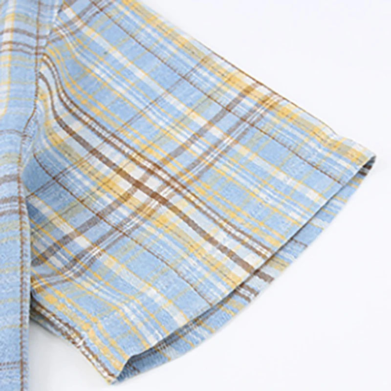 Plaid fabric with blue, yellow, and brown colors on a white background