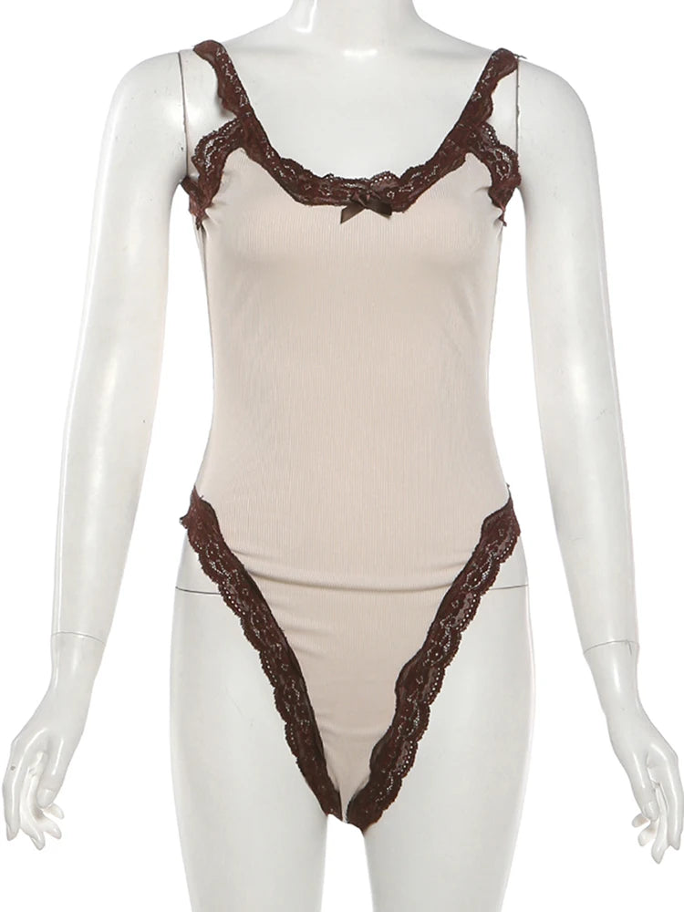Beige bodysuit with brown lace details on a mannequin against a white background