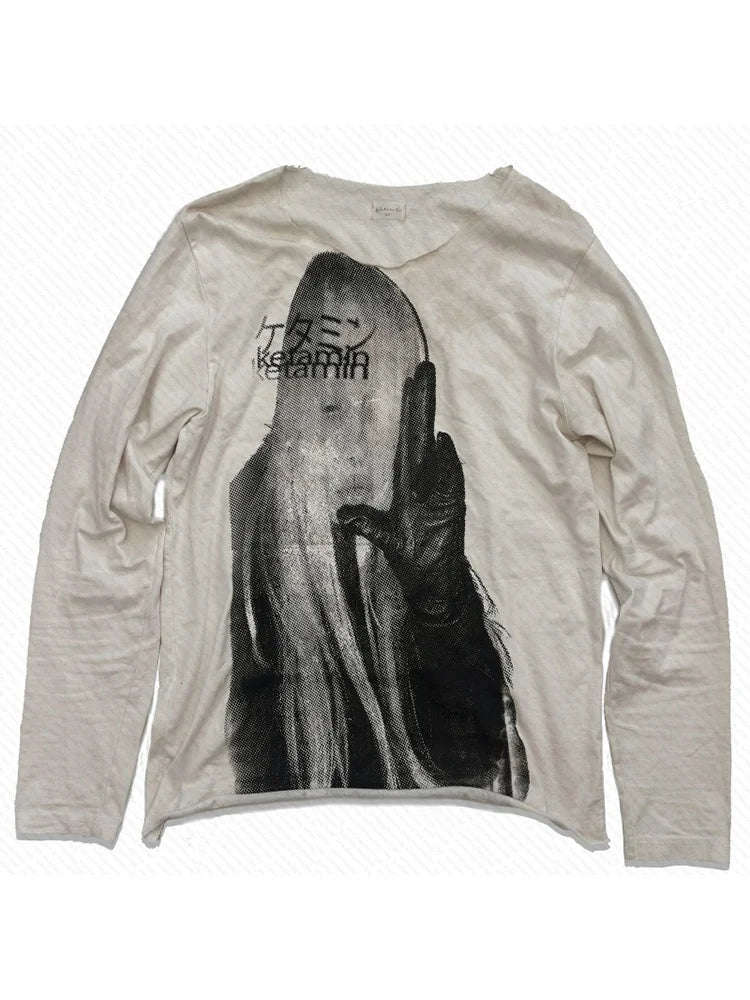 Beige long-sleeve shirt with graphic design on a white background