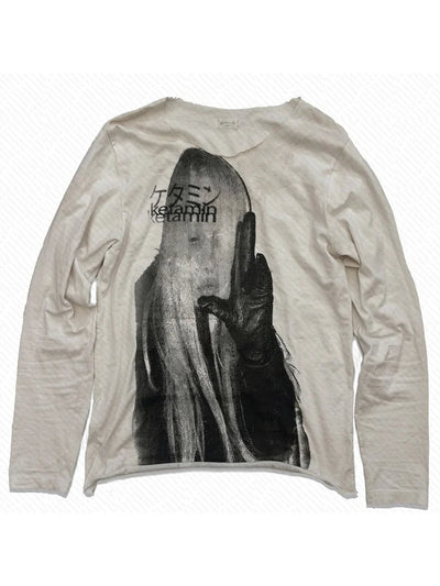 Beige long-sleeve shirt with graphic design on a white background